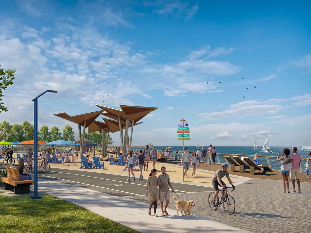 People enjoying landscaped paths and gathering spaces along the planned waterfront promenade.