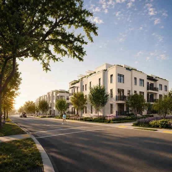 Sunset streetscape with Southbanks townhomes, trees and landscaped front gardens.